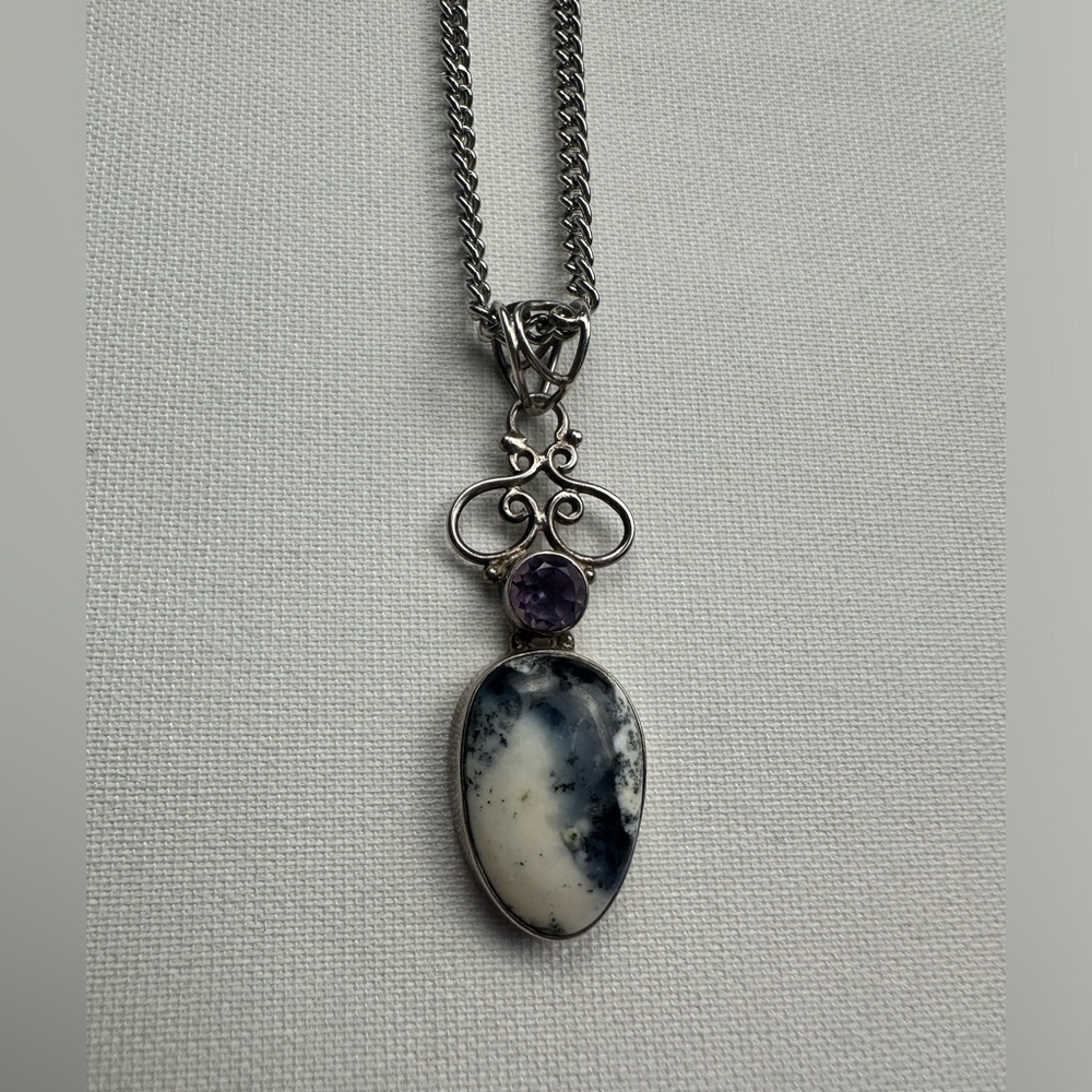 Purple/blue/white gem and unique pretty setting. Silver long necklace.